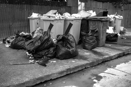 Construction site with waste being cleared by professionals